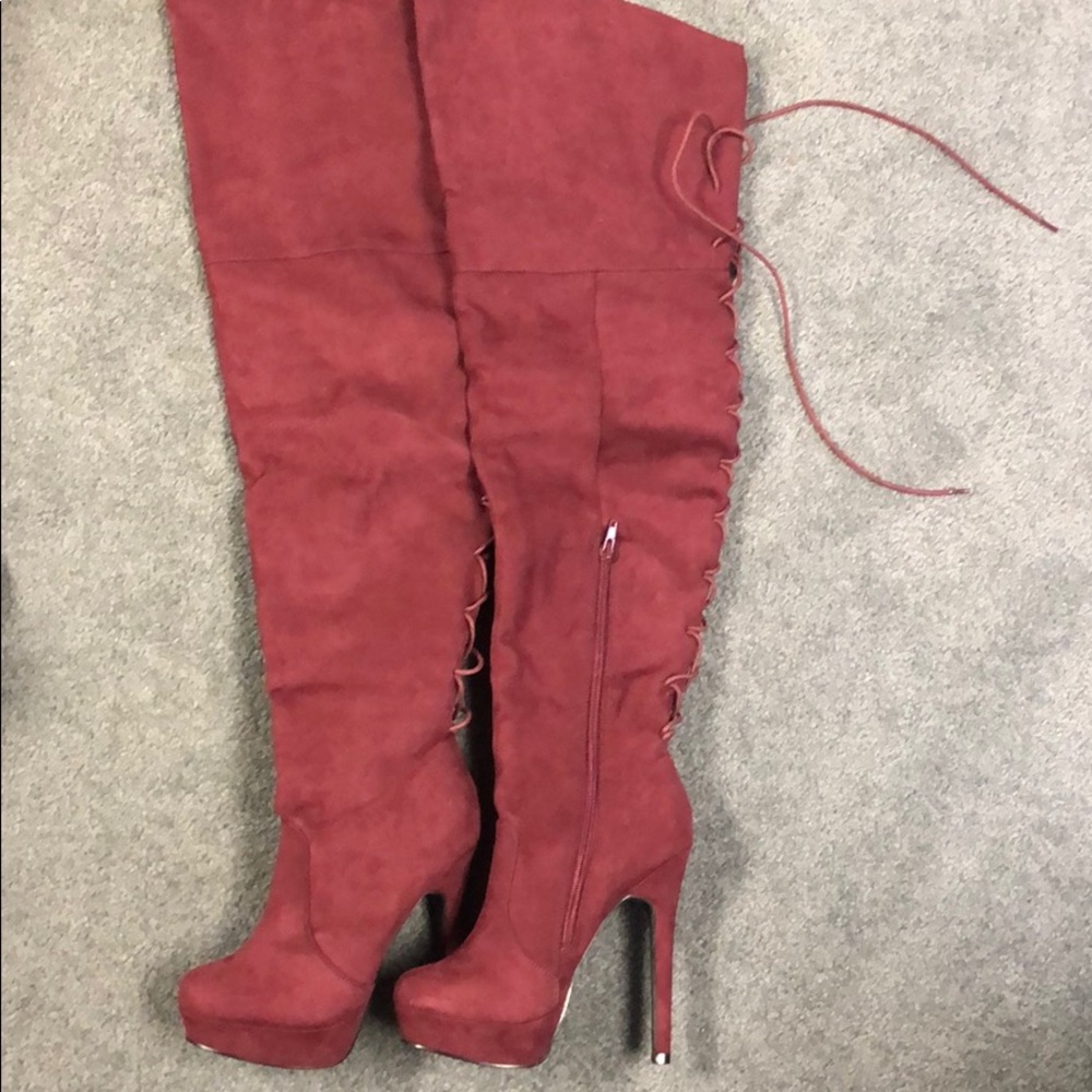 Thigh high maroon heeled boots